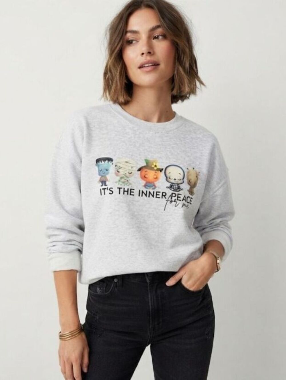 Whimsical Halloween character mediating sweatshirt